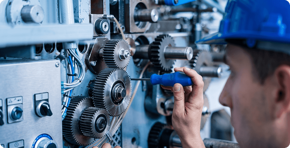 Industrial technician inspecting heavy machinery components